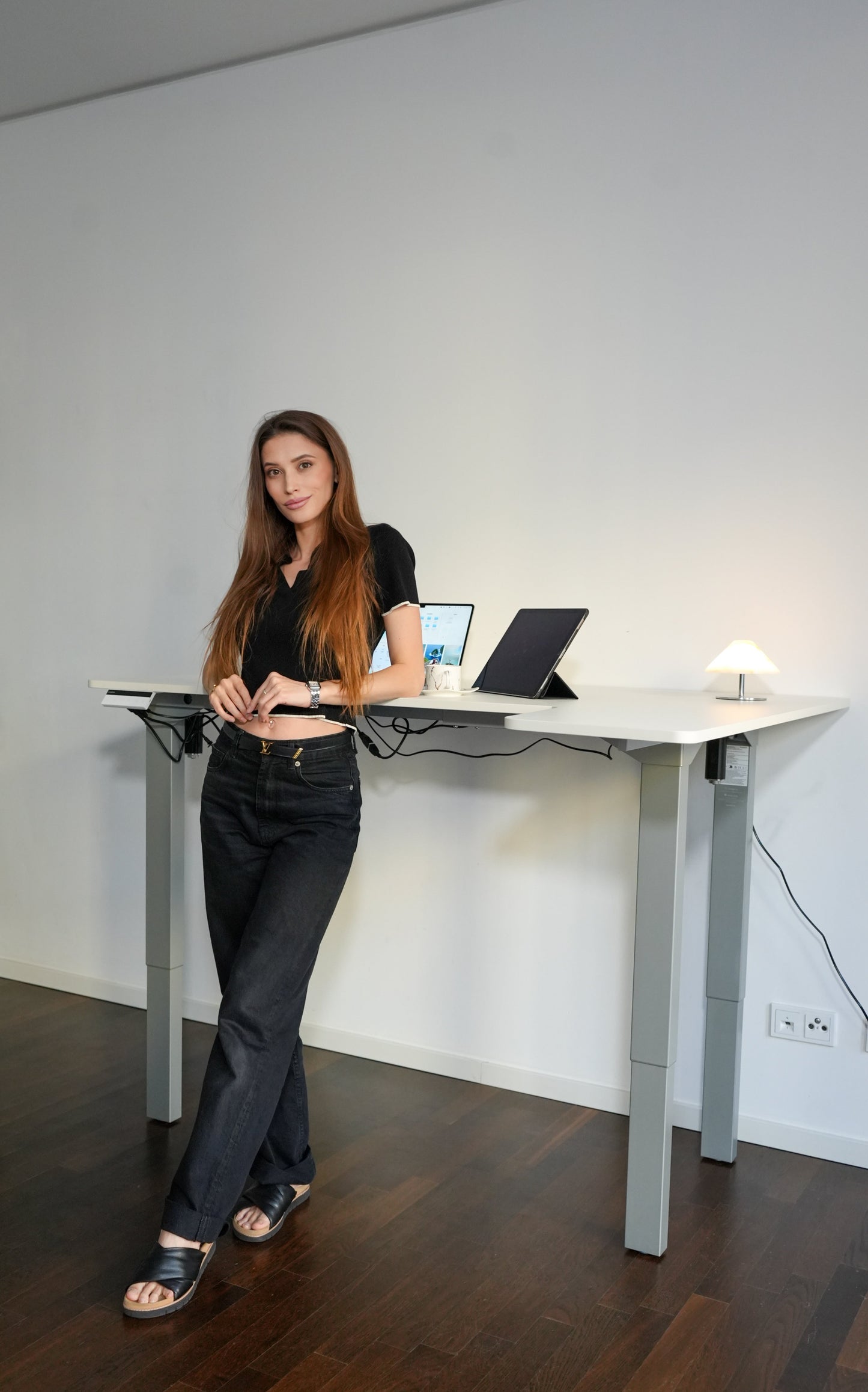 A young lady besides canvas desk