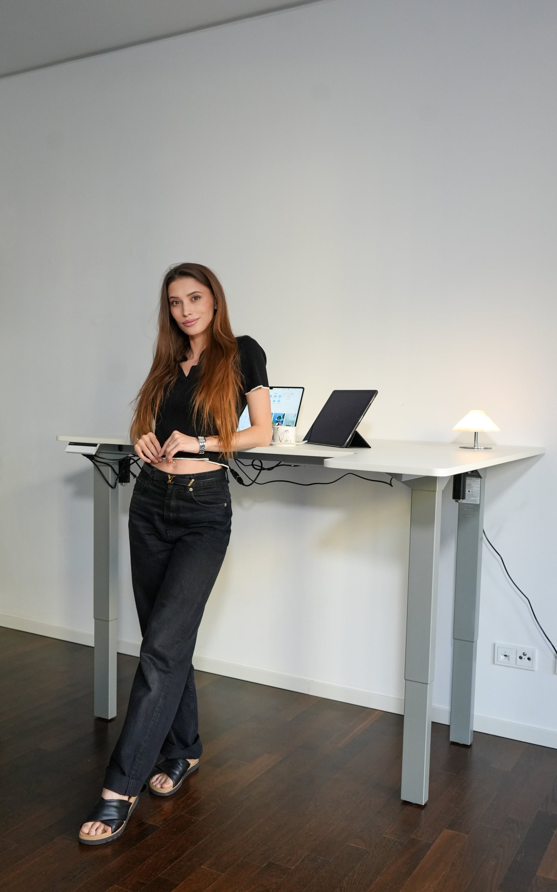 A young lady besides canvas desk